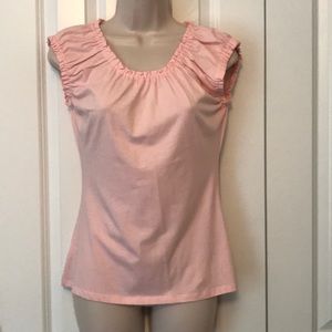 Pink shirt with ruffled shoulders